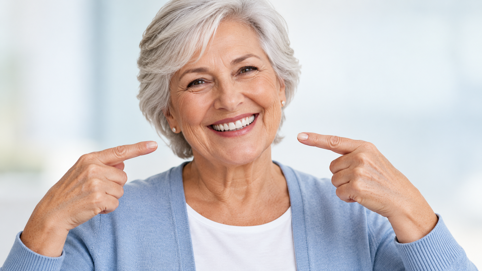 Confident senior patient smiling widely with their new dentures