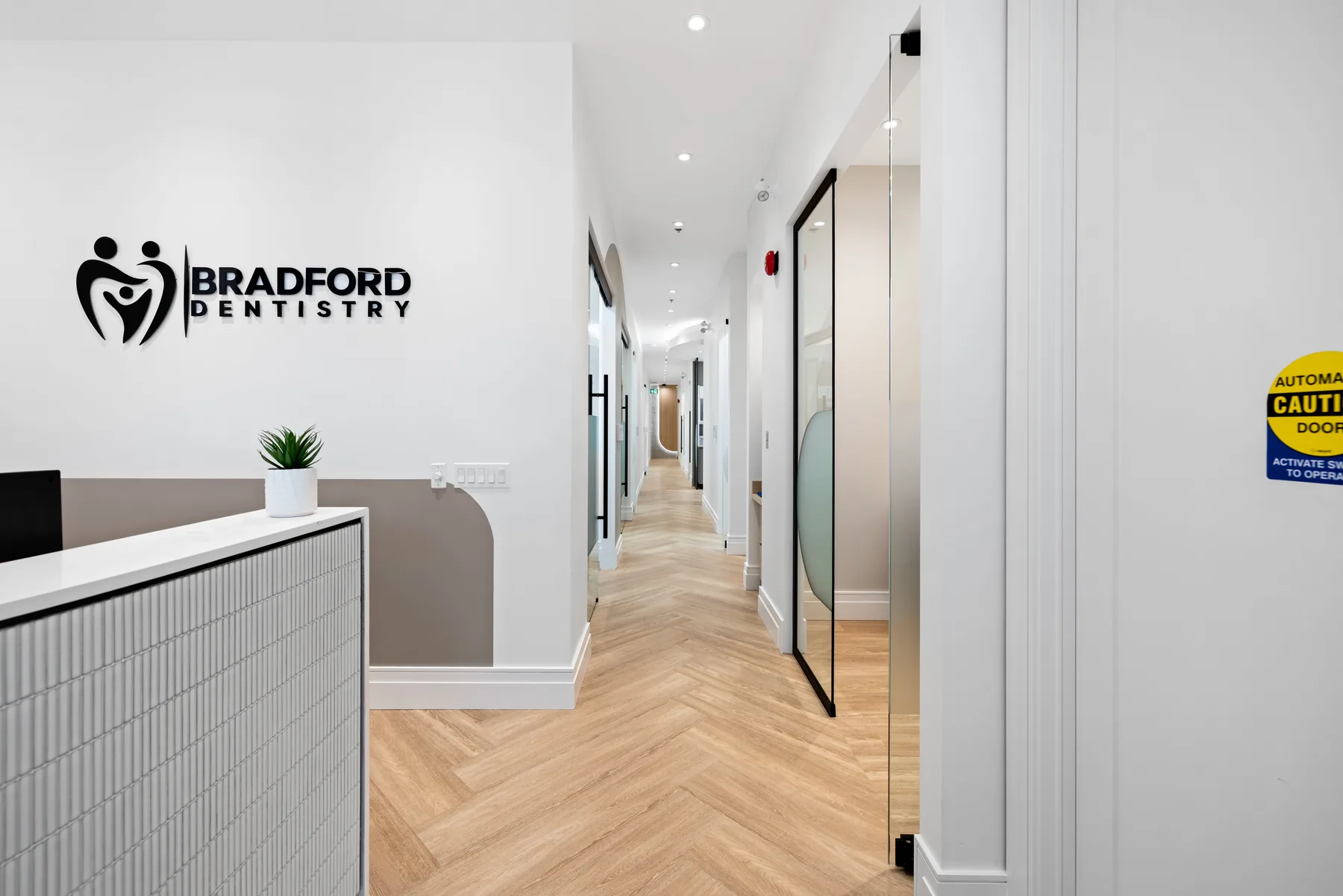 Bright hallway leading to Bradford Dentistry treatment rooms